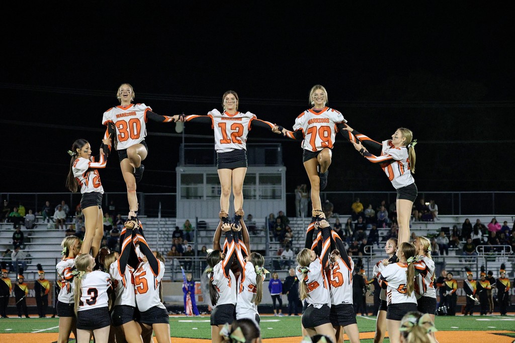 Cheer doing a stunt
