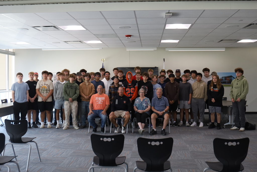 Group of students posing with Michael Christensen, teacher and Christensen's parents 