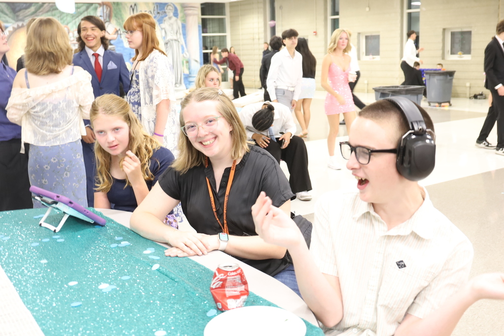 Teacher with two students at a table
