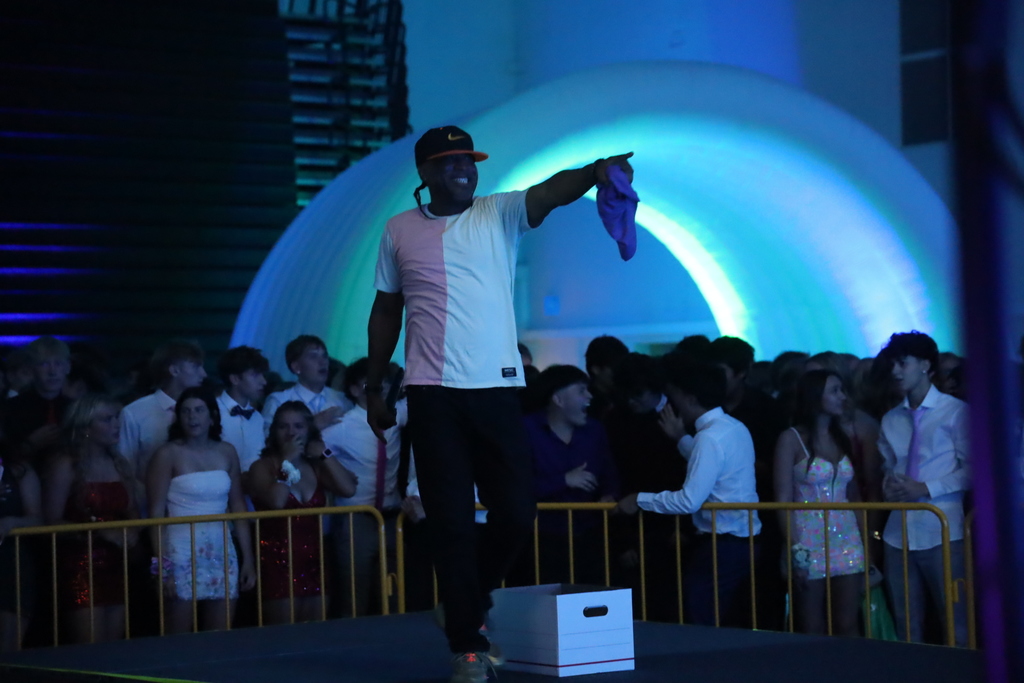 The Dj pointing and smiling 