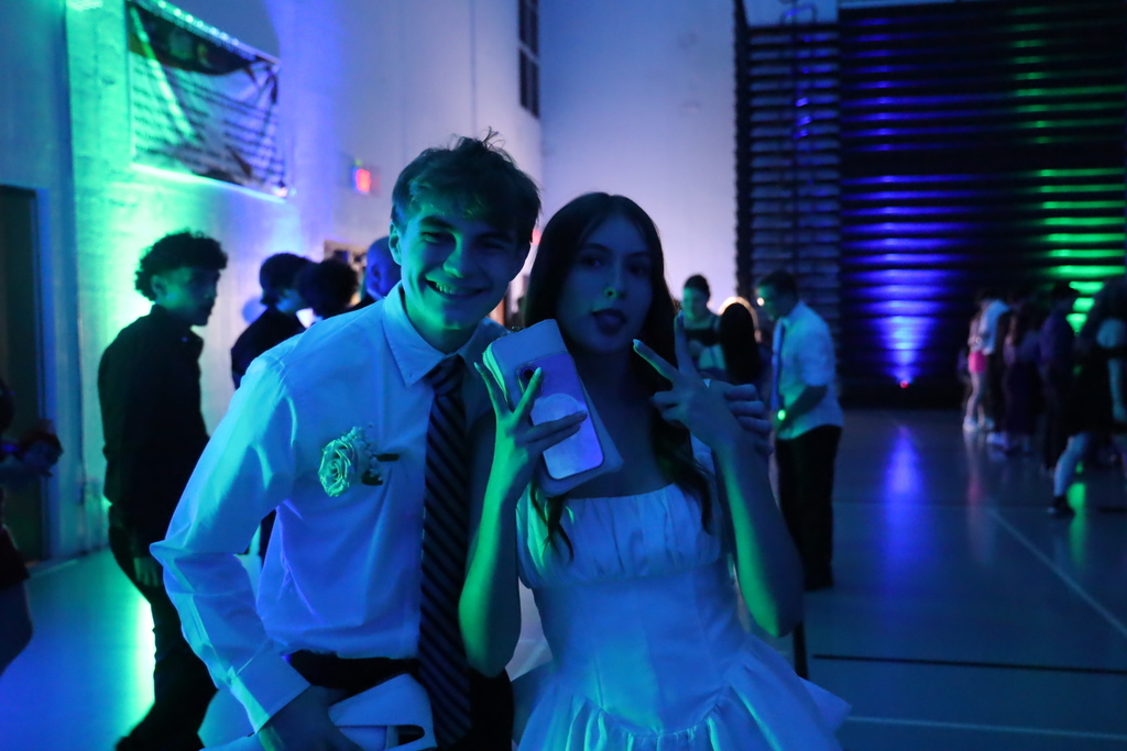Two students smiling and posing 
