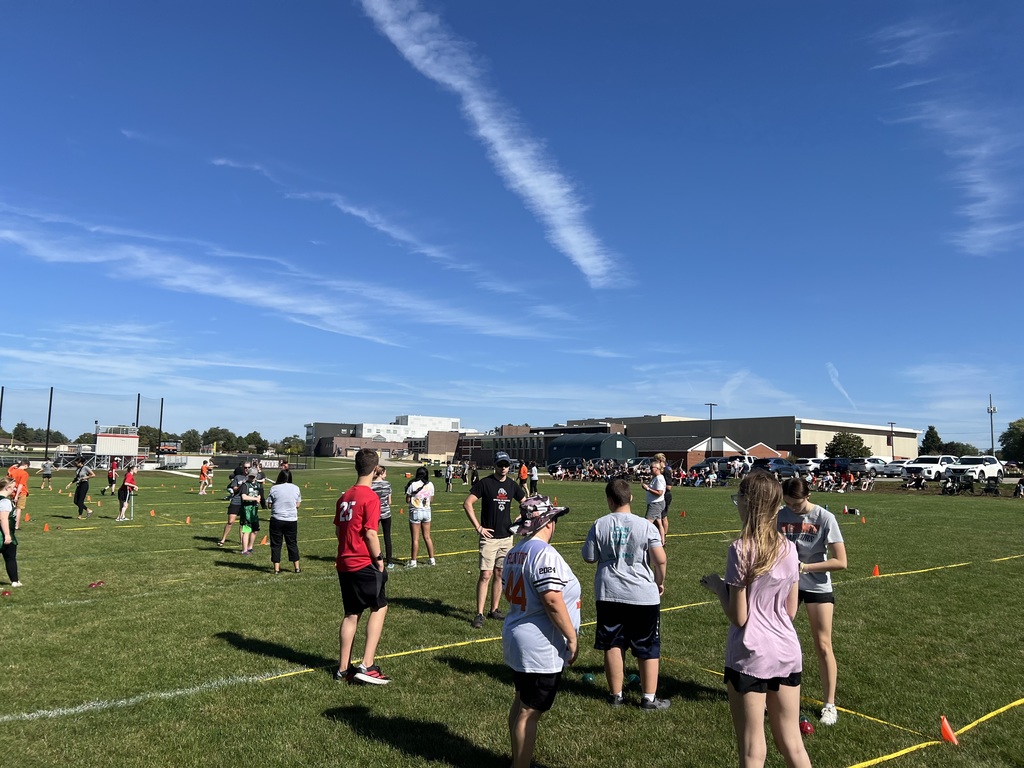 Students standing on bocce ball field
