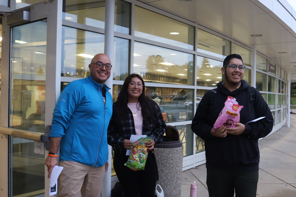 LASO Leaders and student holding candy