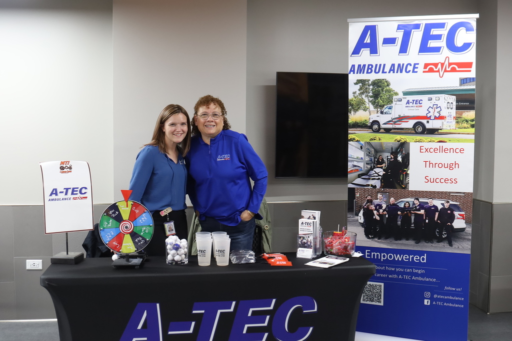 AZTec ambulance vendors posing at their booth 