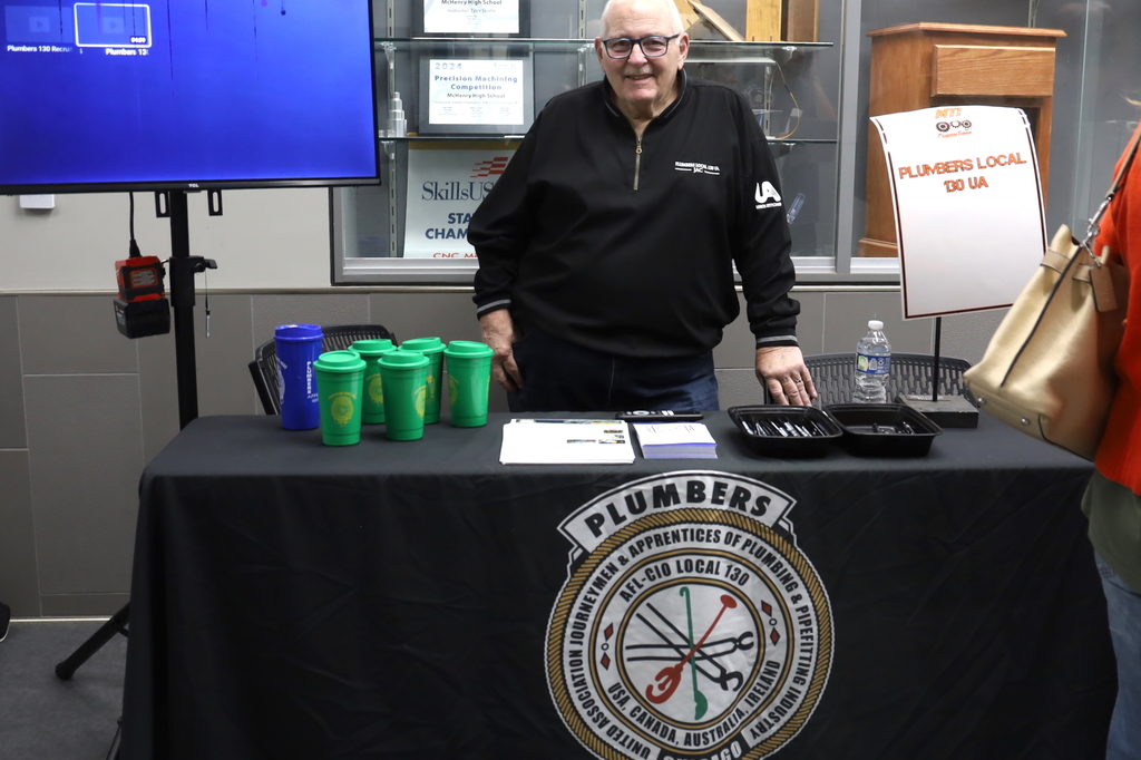 Vendor representing plumbers union at booth