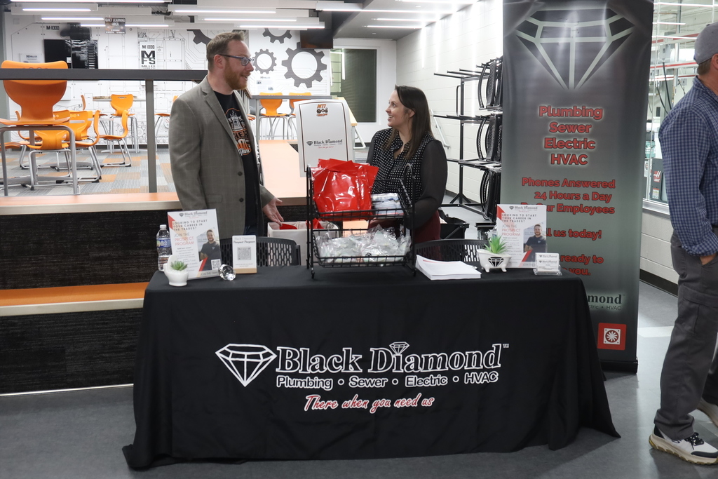Mr. Menke talking to Black Diamond at their booth 