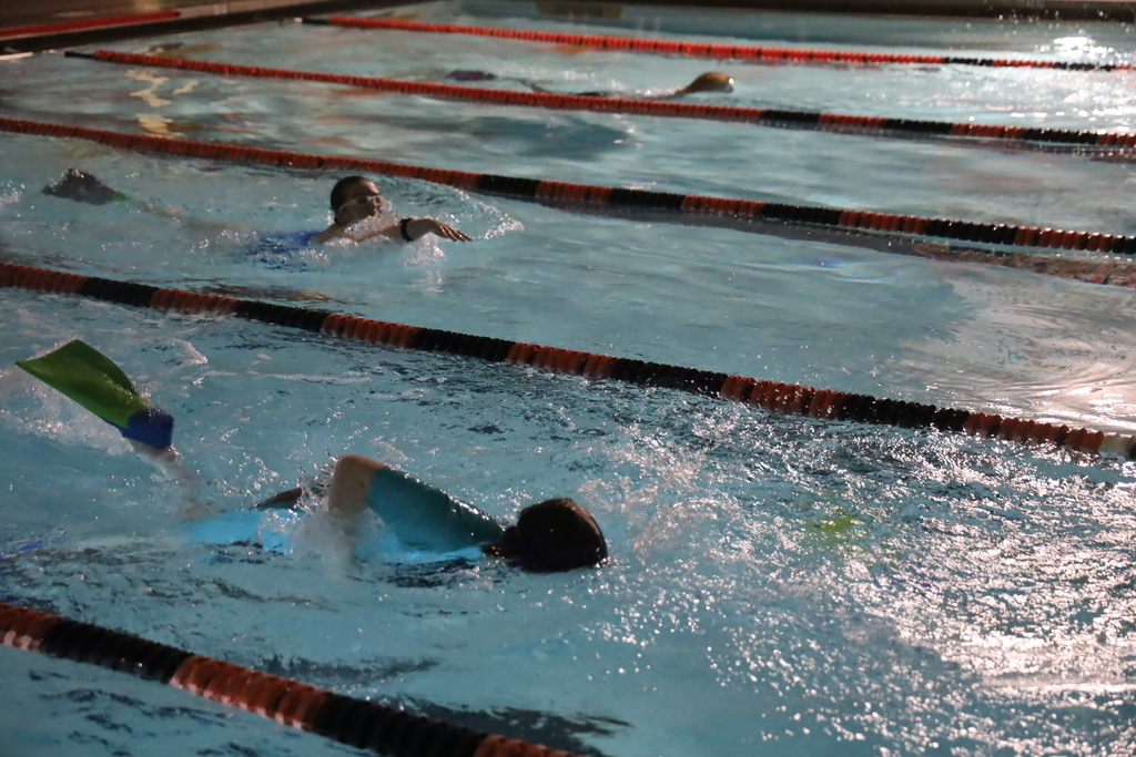Two students swimming laps