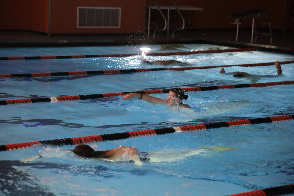Students swimming laps 