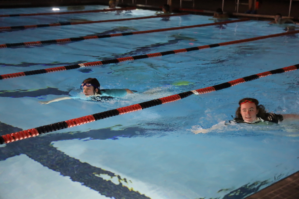 Two students swimming