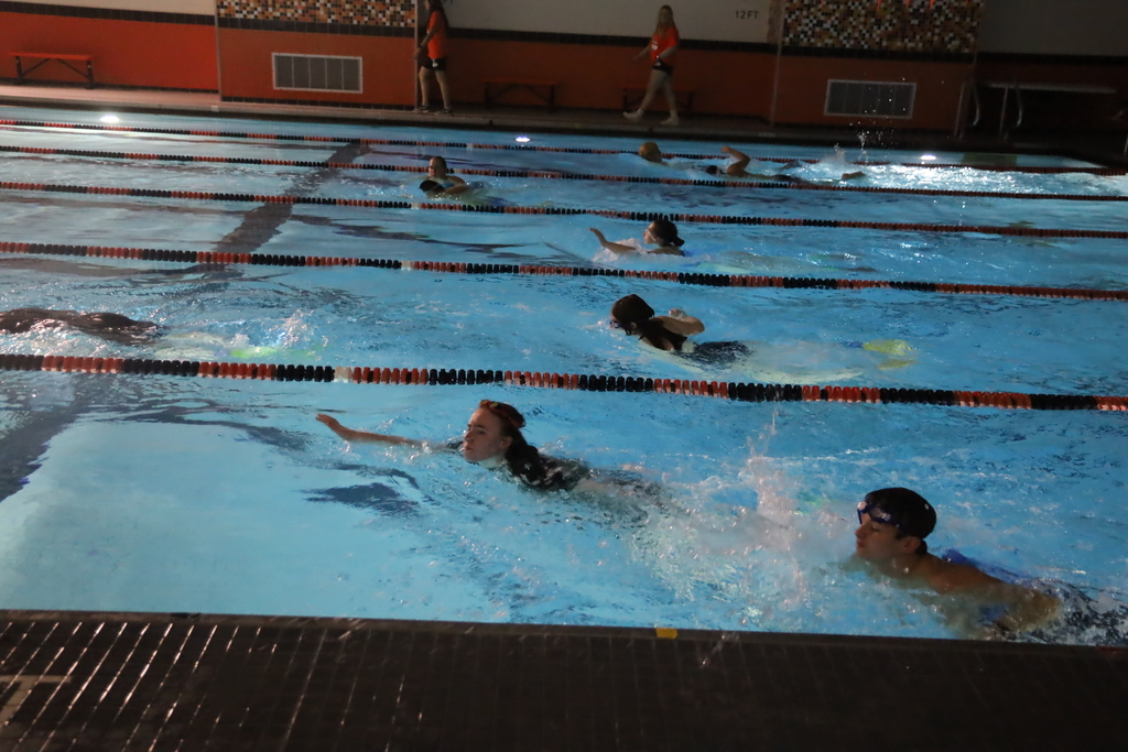 Students swimming laps