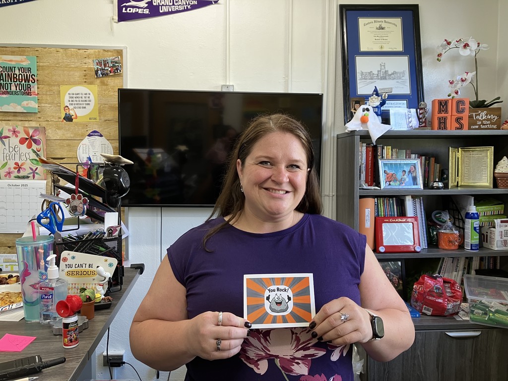 Leah Pietraszewski holding "You Rock" card