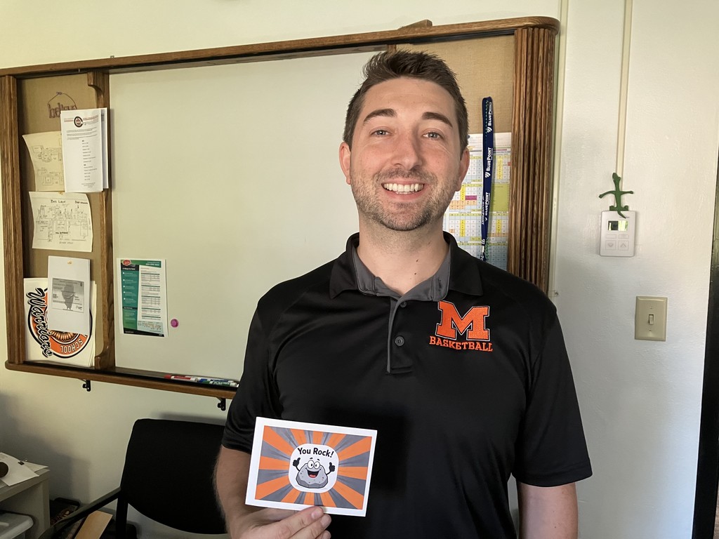 Dan Glick holding "You Rock" card