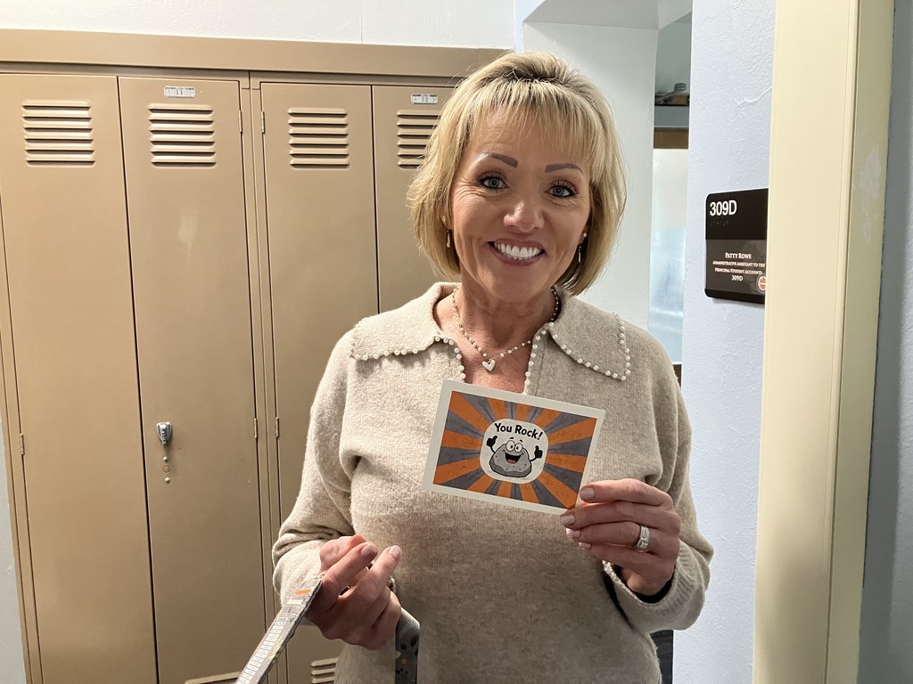 Tracy Gitzinger holding "You Rock" card