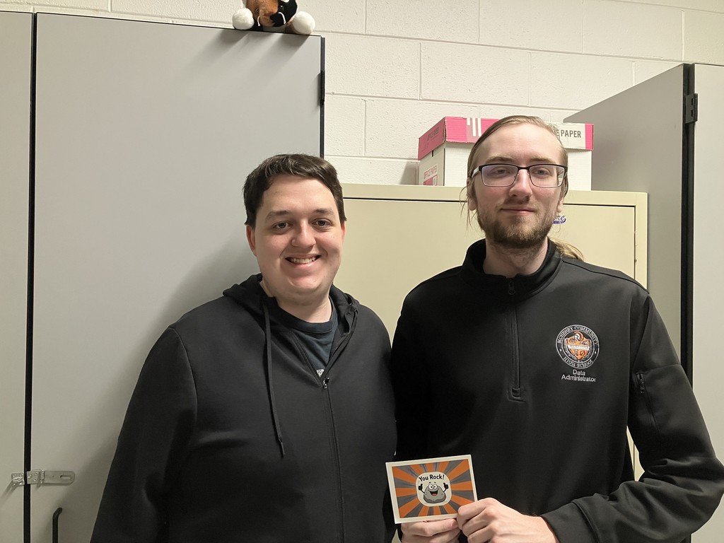 Noah and Zack holding "You Rock" card