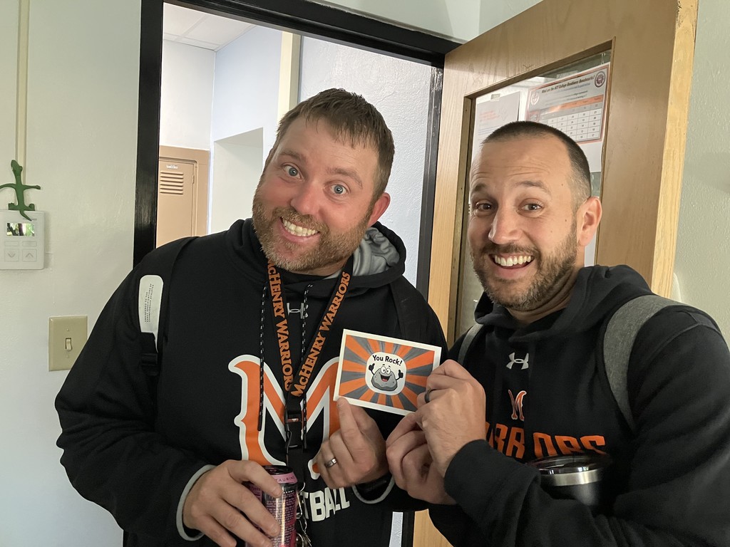 Hutchinson and Swanson holding "You Rock" card