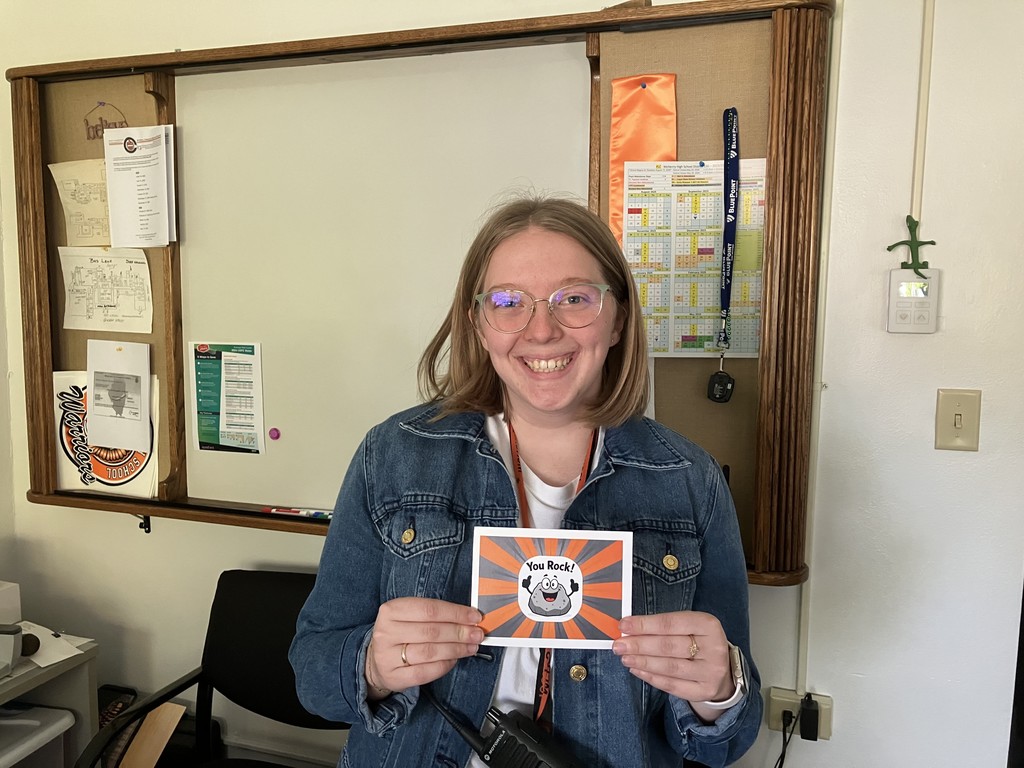 Taylor Keller holding "You Rock" card