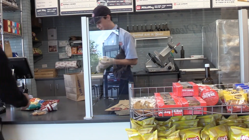 Student working at Jersey Mike's