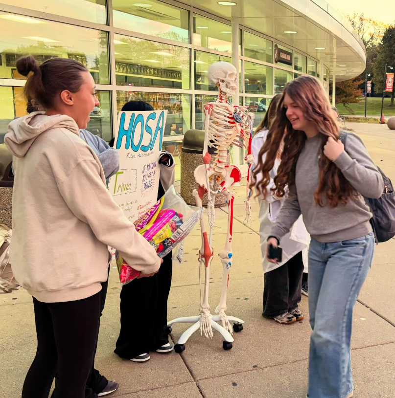 Student walking in getting candy