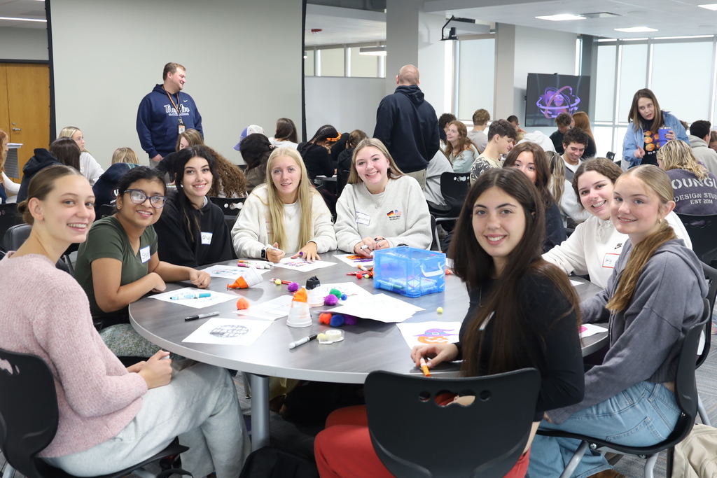 Students at a table with activities 
