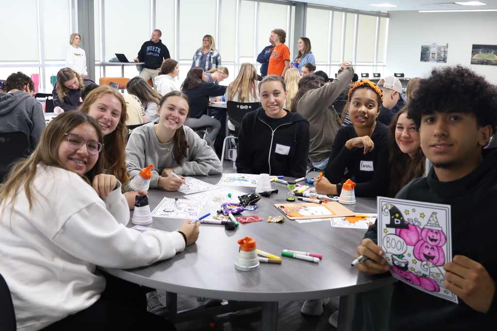 Students at a table with activities 