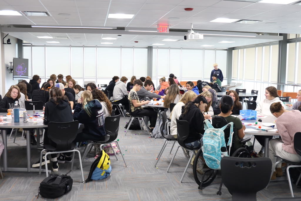Students at a tables with activities 