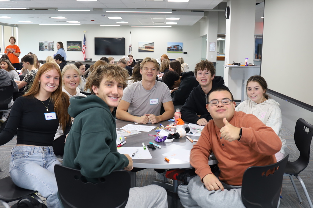 Students at a table with activities 
