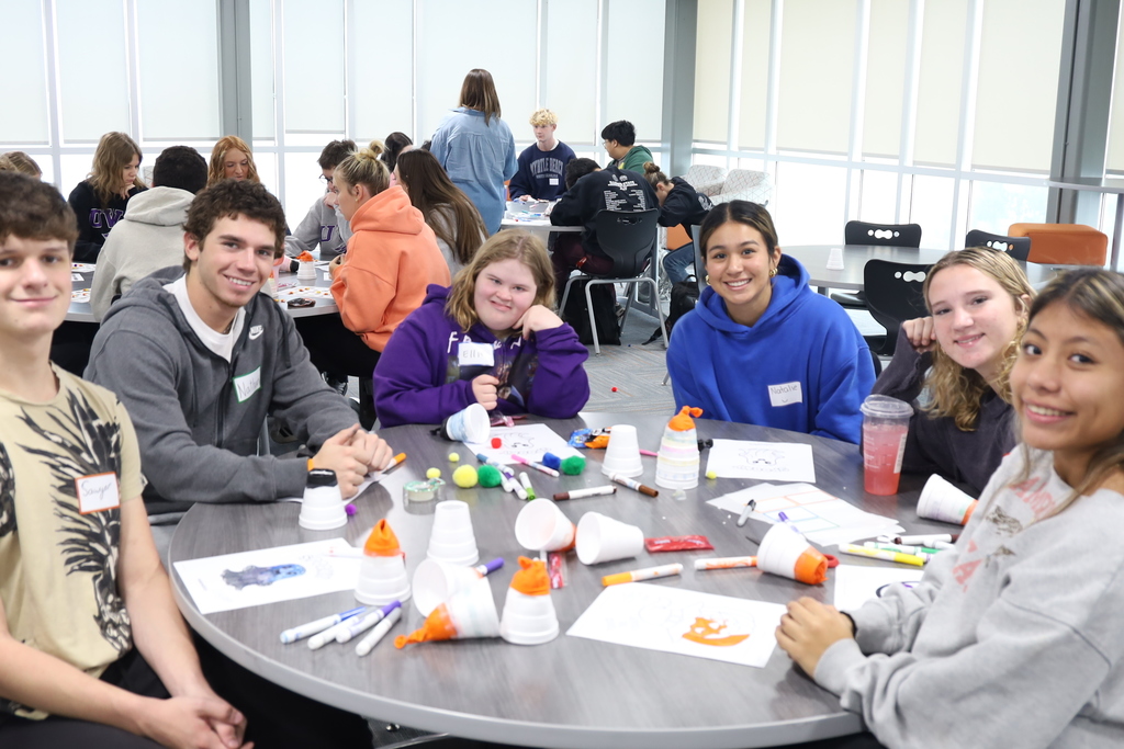 Students at a table with activities 