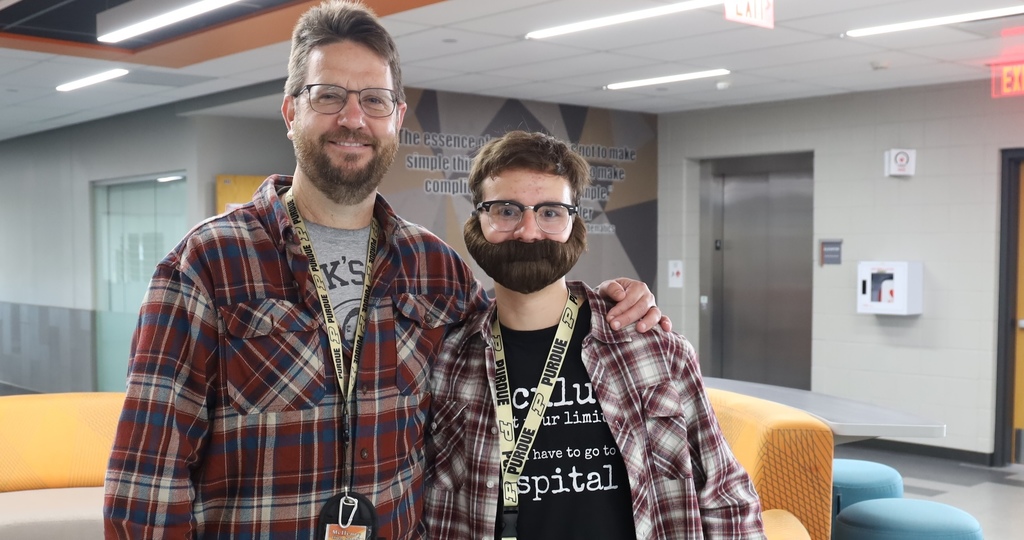 Student with his math teacher dressed like his math teacher