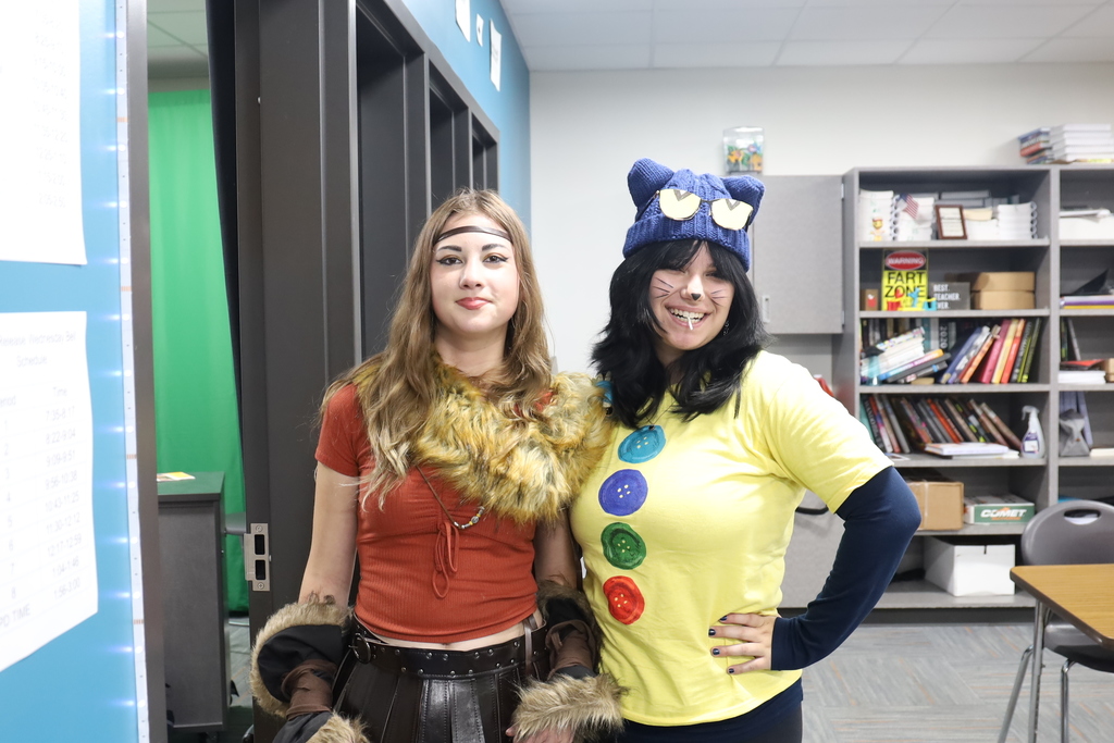 Student with button shirt and knit hat, other student as female from How to Train Your Dragon