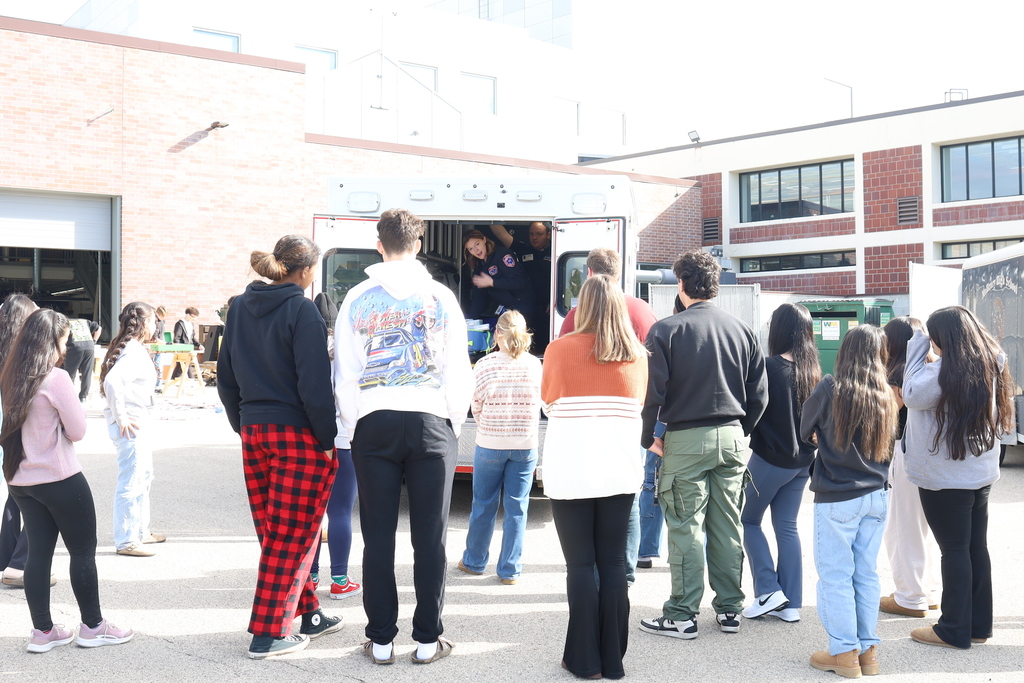 Group of students looking at the ambulance 