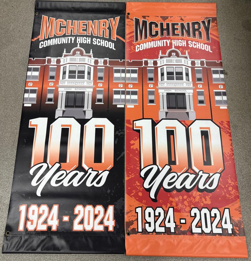 Two Banners, one Orange, one black. McHenry Community High School 100 years 1924-2024