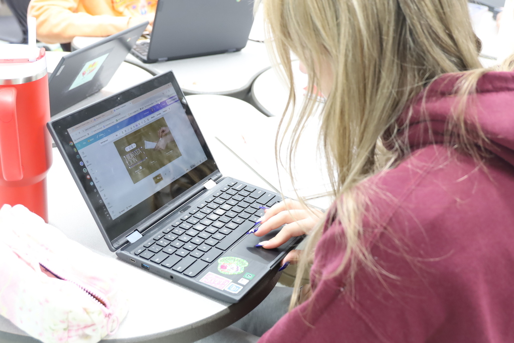 Student working on a canva tempolate