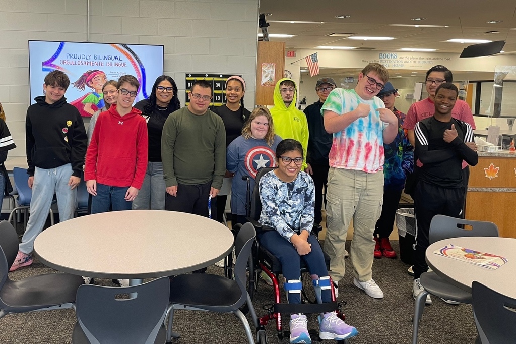 Students posing with author
