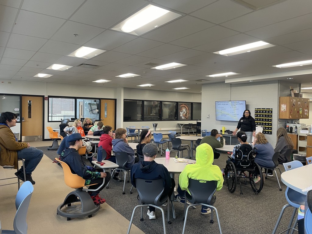 Students in class listening to author
