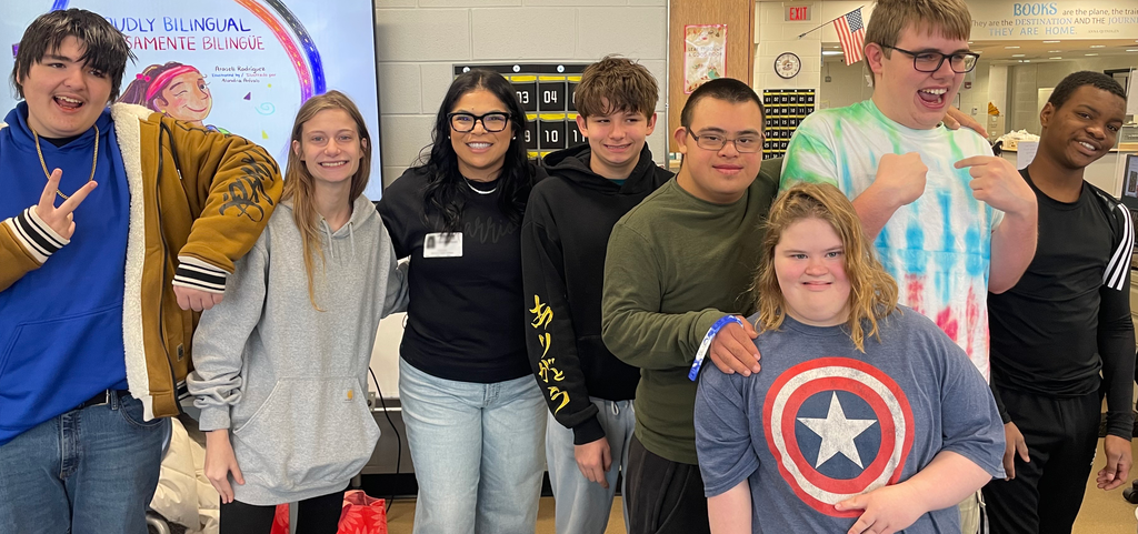 Students posing with author
