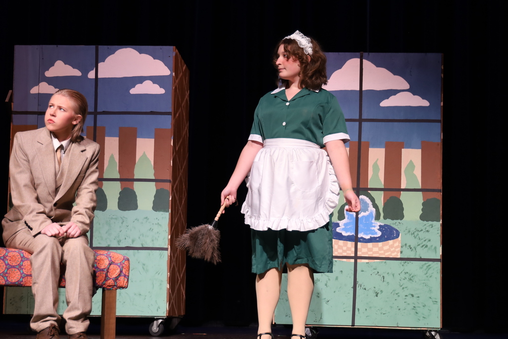 Maid and another character sitting down looking distressed