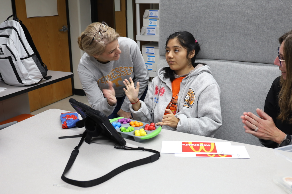 Student getting a high five from teacher