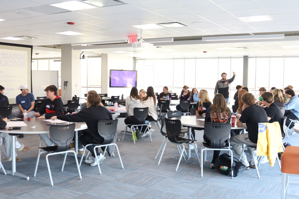 The whole group at tables 