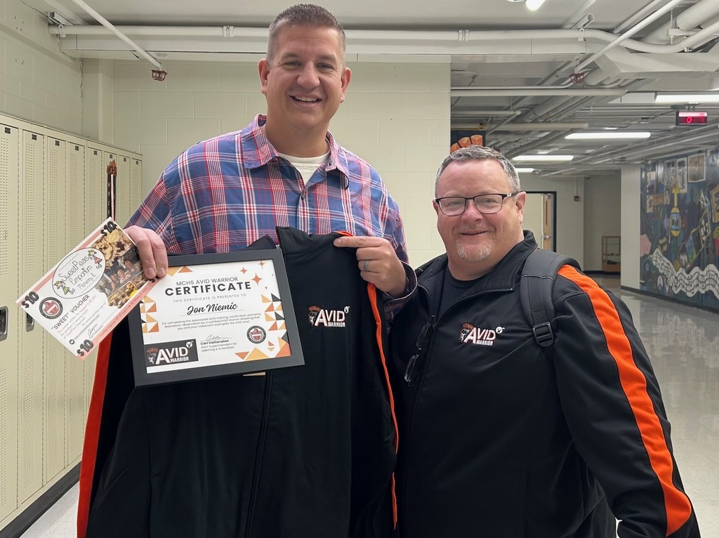 Jon Niemic and Carl Vallianantos. Jon Niemic holding AVID certificate and jacket