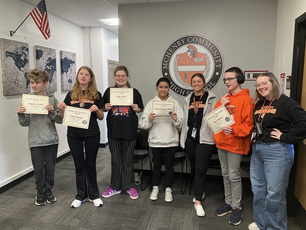 Students of the month with certificates