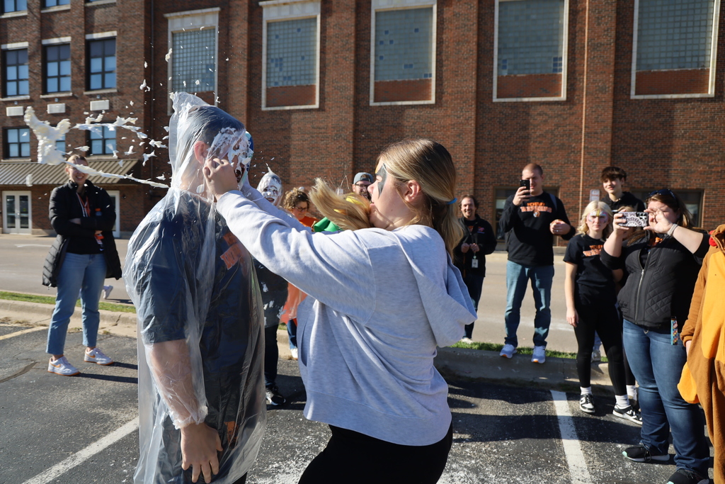 Teacher being pied in the face by a student