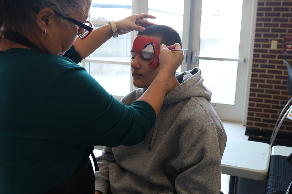 Student getting his face painted