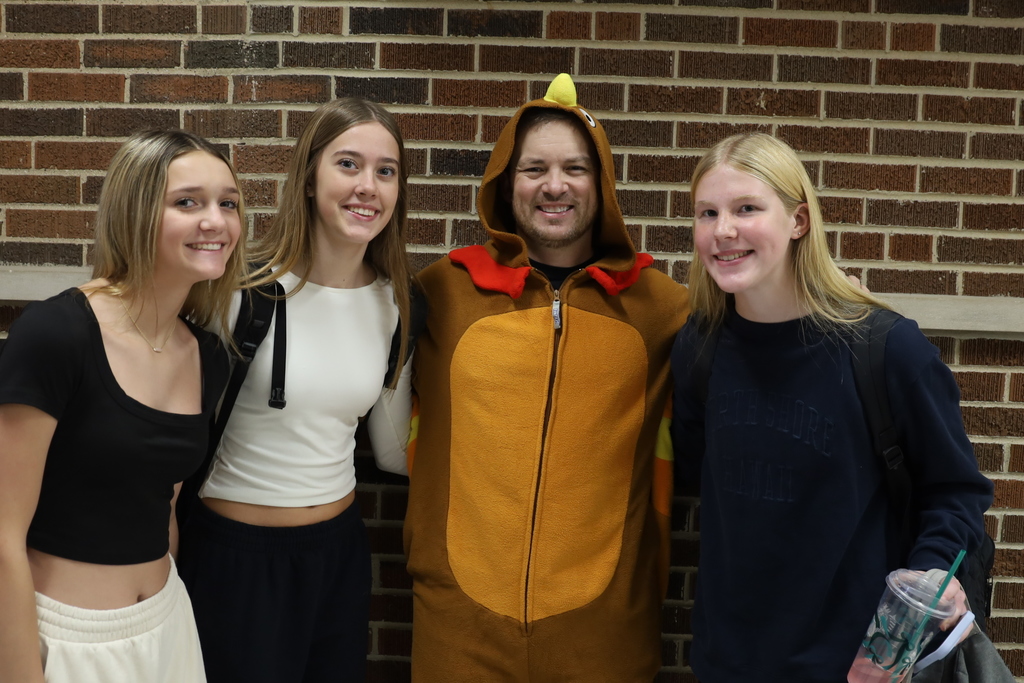 Students with principal dressed as turkey