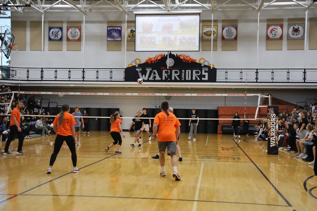 Staff and students playing volleyball