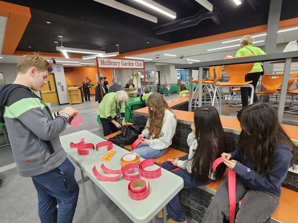 Students working with raffle tickets