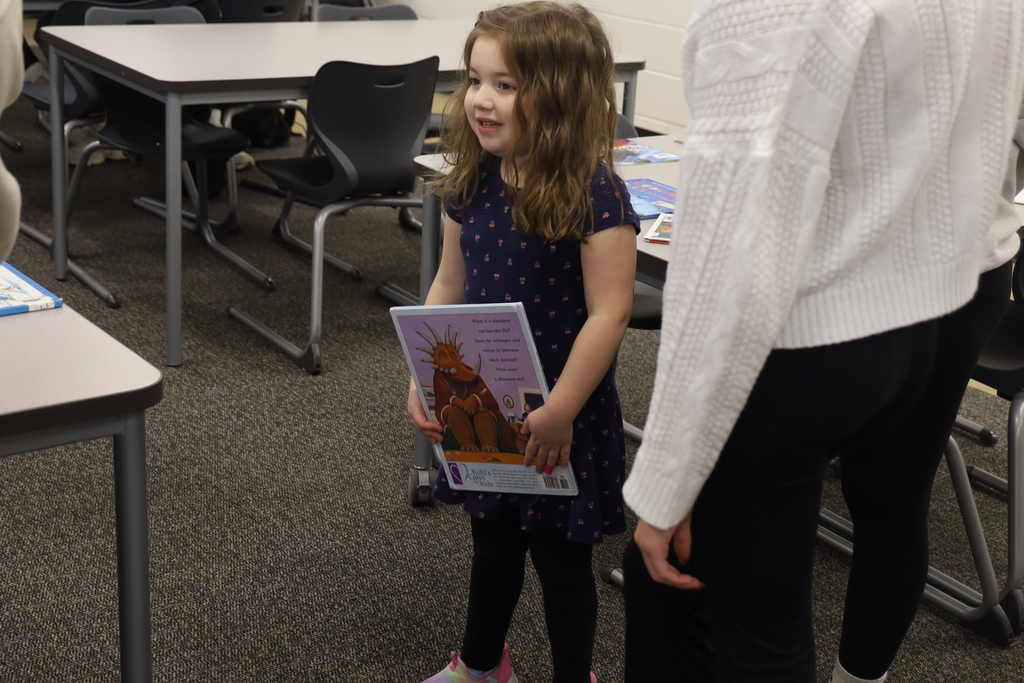 Preschooler holding a book
