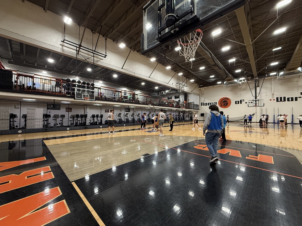 Students playing basketball in the gym