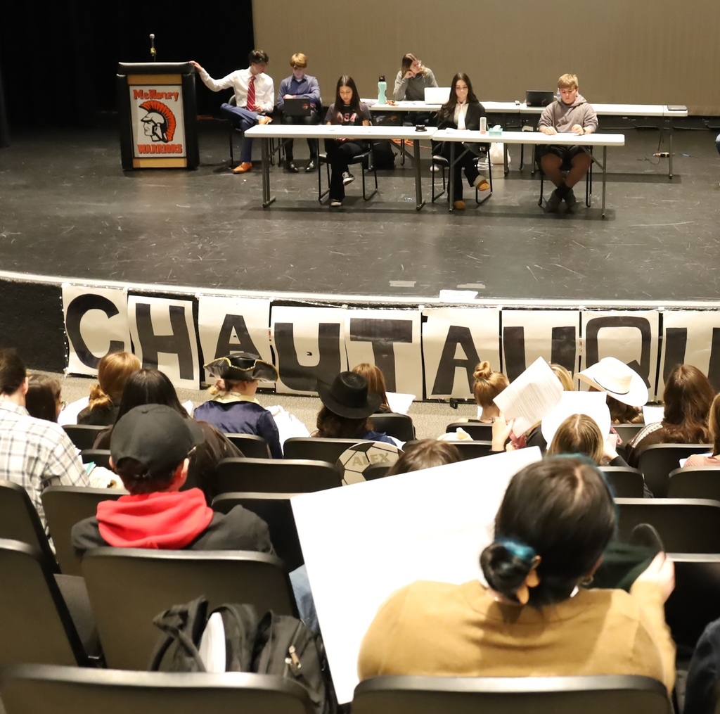 Students sitting in seats at Chautaqua other students on stage