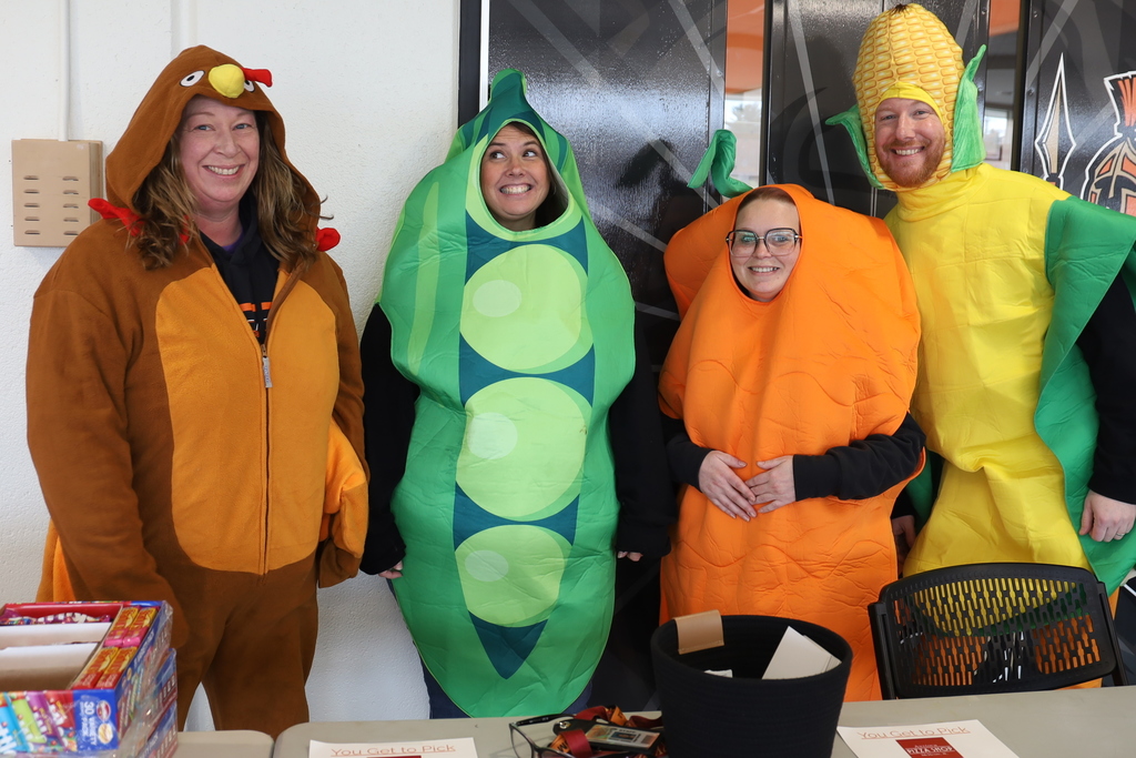 Staff dressed as turkey, peas, carrot and corn 