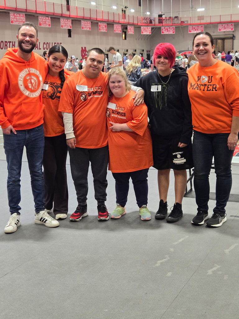 Coaches and students posing together